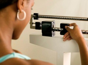 contraceptives and weight  - woman on scale
