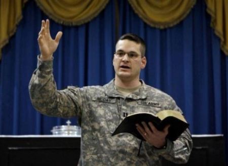 Military chaplain preaching