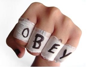 Obey written on hand